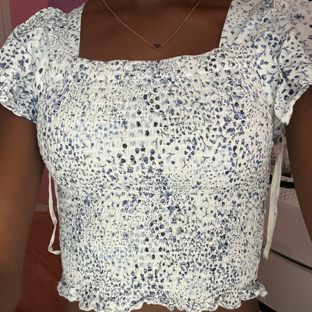 white and blue floral blouse with square neckline